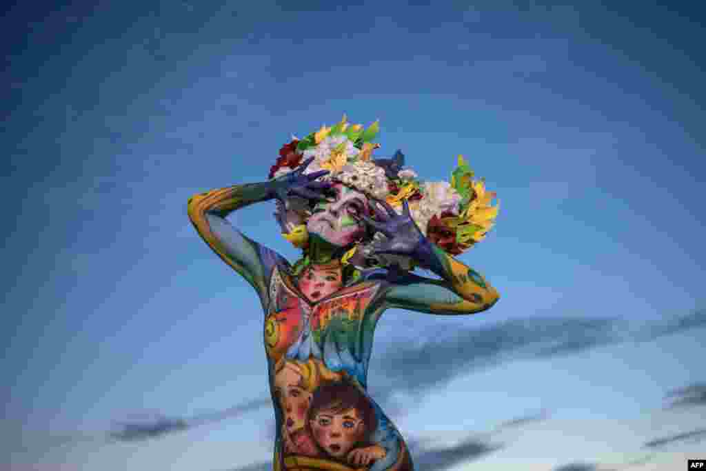 A model poses for a photo during the Daegu International Bodypainting Festival in Daegu, South Korea, Aug. 26, 2017.