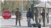 Uzbek border security officers inspecting an Afghan citizen at Termez-Hairatan crossing, Uzbekistan, Nov. 3, 2021 (VOA)