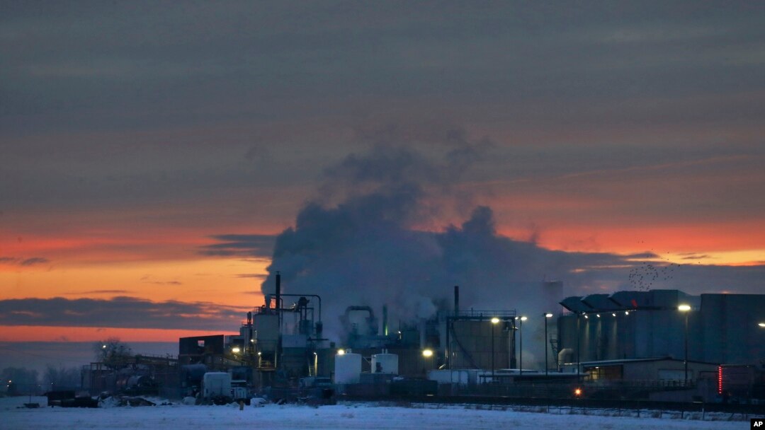 FILE - In this Jan. 11, 2016 photo, dawn approaches over the meat processing plant owned and run by Cargill Meat Solutions, in Fort Morgan, a small town on the eastern plains of Colorado. 