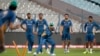 Watched by team mates, Pakistan's Mohammad Amir, third right, practices taking catches during a training session ahead of the ICC World Twenty20 2016 match against India in Kolkata, India, March 18, 2016. 