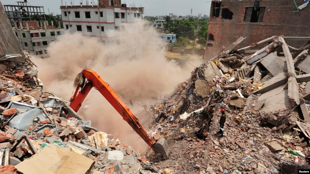 Last standing part of Rana Plaza collapses during army rescue operation in Savar, Bangladesh, May 2, 2013.