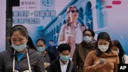 香港民眾帶著口罩在中環商業區活動。(2020年2月11日)