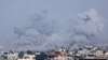 A picture taken from Rafah shows smoke billowing over Khan Yunis in the southern Gaza Strip during Israeli bombardment on January 9, 2024.