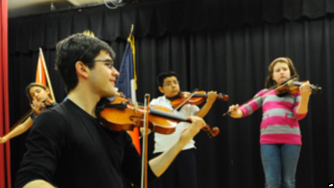 Nathan Schram works with his students at P.S. 75, an elementary school in Brooklyn, New York.