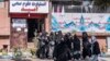 Afghan women who had been studying health studies gather at the Omid Institute of Health Sciences in Kabul, Dec. 3, 2024, a day after the Taliban's Ministry of Health told medical training institute leaders in Afghanistan about a new ban on women's education in the institutes.